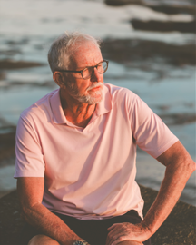 Bruce McCabe, author, sitting by the ocean